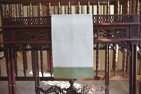 White Hemsitch Guest Towel with Tea Green border. 14"x22"